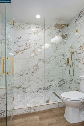 Bathroom, Glass Shower, Interior, Marble Walls, Recessed Lighting, Wood Texture Flooring