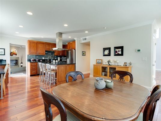 Dining room, Fireplace, Interior, Kitchen, Recessed Lighting, Stainless Steel Appliances, Wood Texture Flooring
