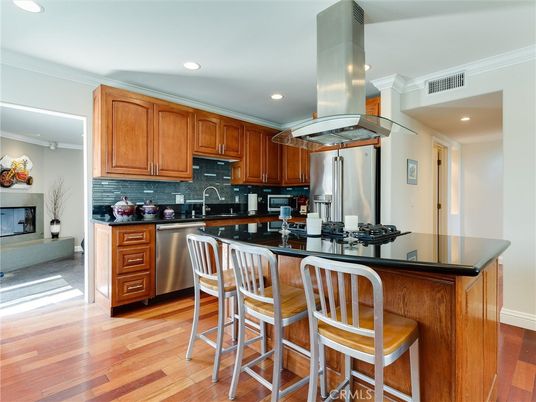 Fireplace, Interior, Kitchen, Recessed Lighting, Stainless Steel Appliances, Wood Texture Flooring