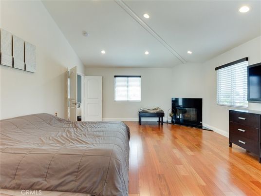 Bedroom, Fireplace, Interior, Recessed Lighting, Wood Texture Flooring
