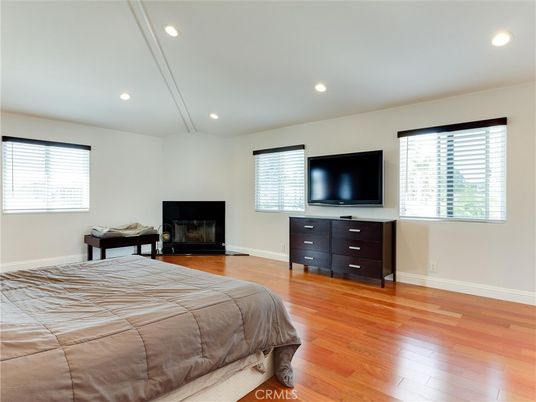 Bedroom, Fireplace, Interior, Recessed Lighting, Wood Texture Flooring