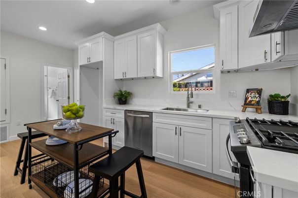 Dining room, Interior, Kitchen, Recessed Lighting, Stainless Steel Appliances, Wood Texture Flooring