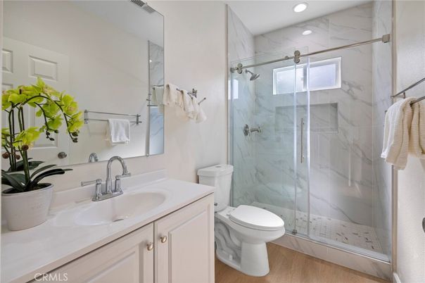 Bathroom, Glass Shower, Interior, Marble Walls, Recessed Lighting, Wood Texture Flooring