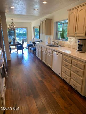 Chandelier, Dining room, Interior, Kitchen, Recessed Lighting, Tile Countertops, Wood Texture Flooring