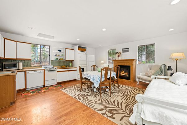 Dining room, Fireplace, Interior, Kitchen, Living room, Recessed Lighting, Wood Texture Flooring