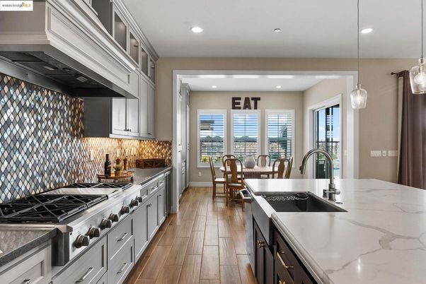 Dining room, Interior, Kitchen, Pendant Lights, Recessed Lighting, Stainless Steel Appliances, Wood Texture Flooring