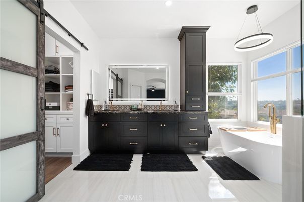 Bathroom, Dual Sink Vanities, Interior, Pendant Lights, Recessed Lighting, Wood Texture Flooring