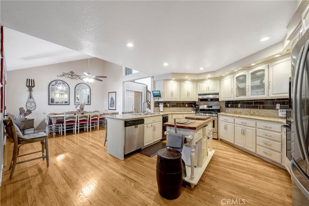 Dining room, Interior, Kitchen, Recessed Lighting, Stainless Steel Appliances, Wood Texture Flooring