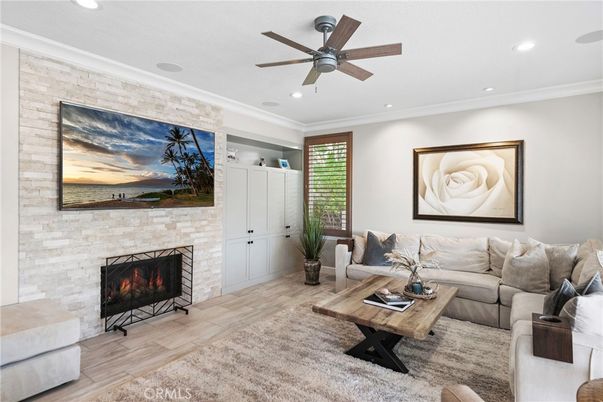 Fireplace, Interior, Living room, Recessed Lighting, Stone Walls, Wood Texture Flooring