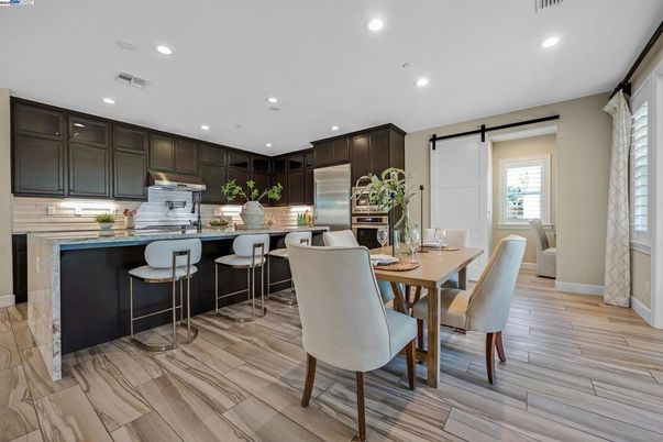Dining room, Interior, Kitchen, Recessed Lighting, Stainless Steel Appliances, Wood Texture Flooring