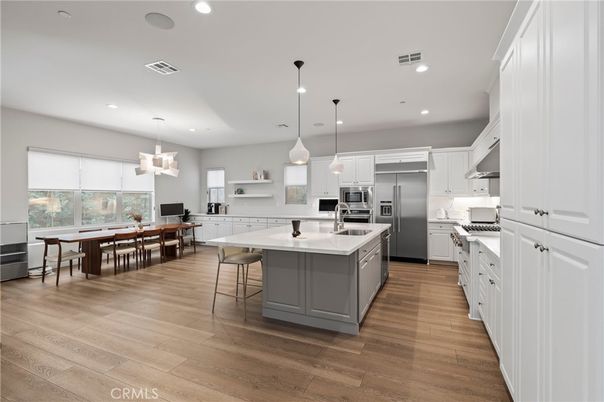 Dining room, Interior, Kitchen, Pendant Lights, Recessed Lighting, Stainless Steel Appliances, Wood Texture Flooring
