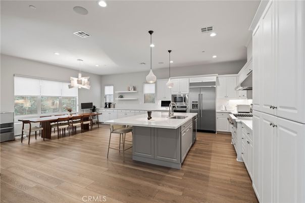 Dining room, Interior, Kitchen, Pendant Lights, Recessed Lighting, Stainless Steel Appliances, Wood Texture Flooring