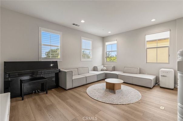 Fireplace, Interior, Living room, Piano, Recessed Lighting, Wood Texture Flooring