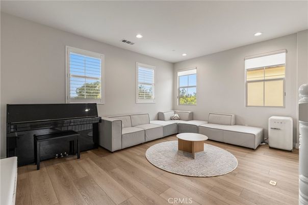 Fireplace, Interior, Living room, Piano, Recessed Lighting, Wood Texture Flooring
