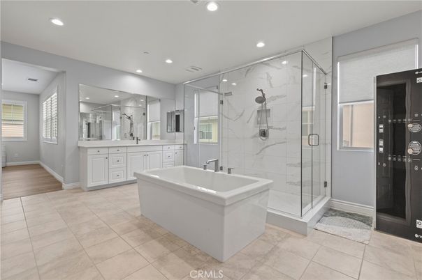 Bathroom, Free Standing Baths, Glass Shower, Interior, Marble Walls, Recessed Lighting, Wood Texture Flooring