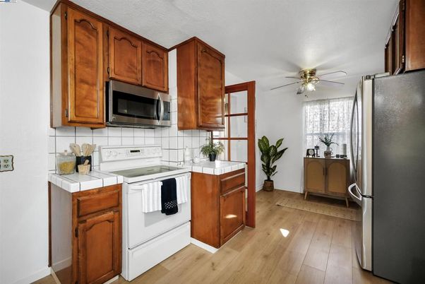 Interior, Kitchen, Tile Countertops, Wood Texture Flooring