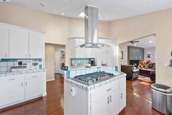 Fireplace, Interior, Kitchen, Living room, Recessed Lighting, Tile Countertops, Wood Texture Flooring