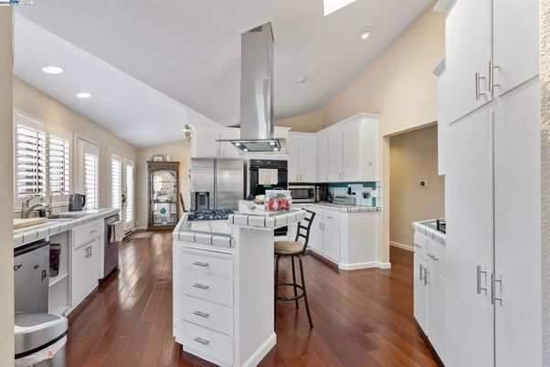 Interior, Kitchen, Recessed Lighting, Stainless Steel Appliances, Tile Countertops, Wood Texture Flooring