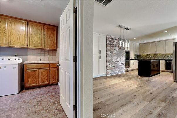 Interior, Kitchen, Pendant Lights, Recessed Lighting, Tile Countertops, Wood Texture Flooring