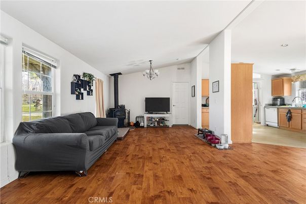 Chandelier, Fireplace, Interior, Kitchen, Living room, Recessed Lighting, Wood Texture Flooring