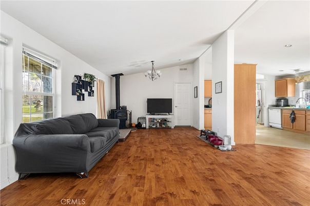 Chandelier, Fireplace, Interior, Kitchen, Living room, Recessed Lighting, Wood Texture Flooring