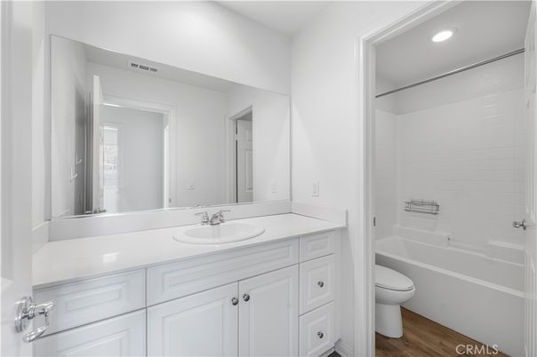 Bathroom, Dual Sink Vanities, Interior, Recessed Lighting, Wood Texture Flooring