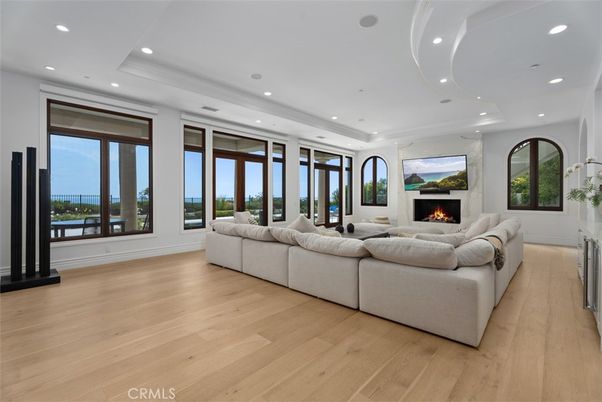 Fireplace, Interior, Living room, Recessed Lighting, Water, Wood Texture Flooring