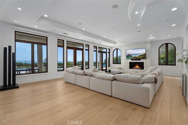 Fireplace, Interior, Living room, Recessed Lighting, Water, Wood Texture Flooring