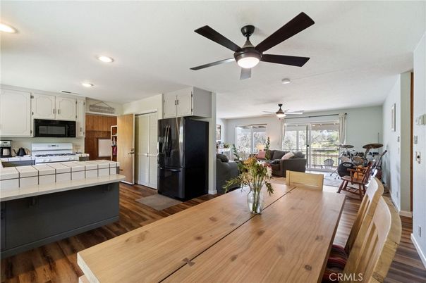 Dining room, Interior, Kitchen, Living room, Recessed Lighting, Tile Countertops, Wood Texture Flooring