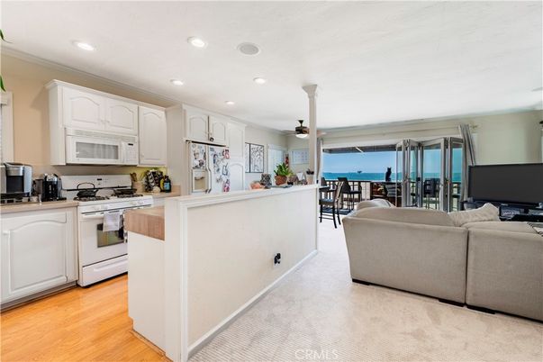 Dining room, Interior, Kitchen, Living room, Recessed Lighting, Water, Wood Texture Flooring
