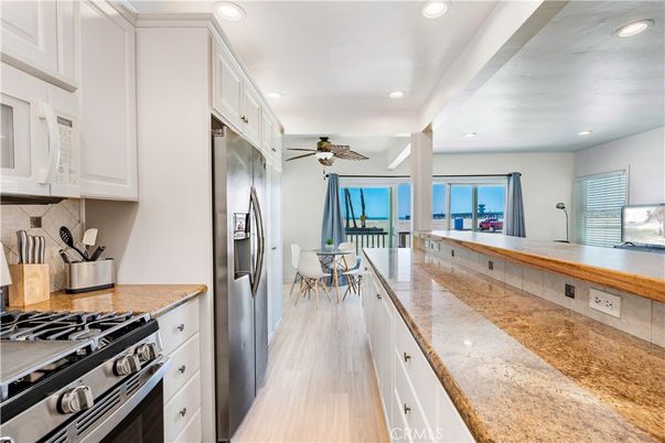 Dining room, Interior, Kitchen, Recessed Lighting, Stainless Steel Appliances, Wood Texture Flooring