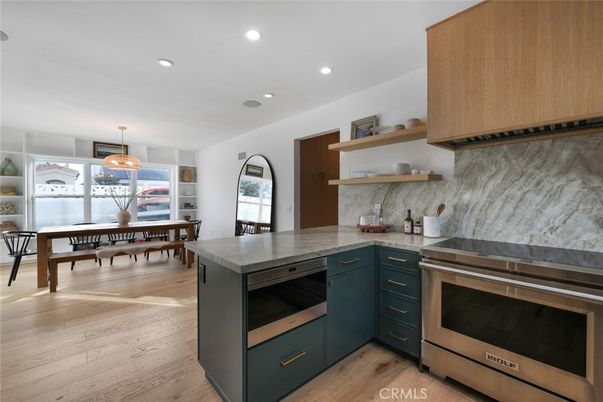 Dining room, Interior, Kitchen, Marble Walls, Pendant Lights, Recessed Lighting, Stainless Steel Appliances, Wood Texture Flooring
