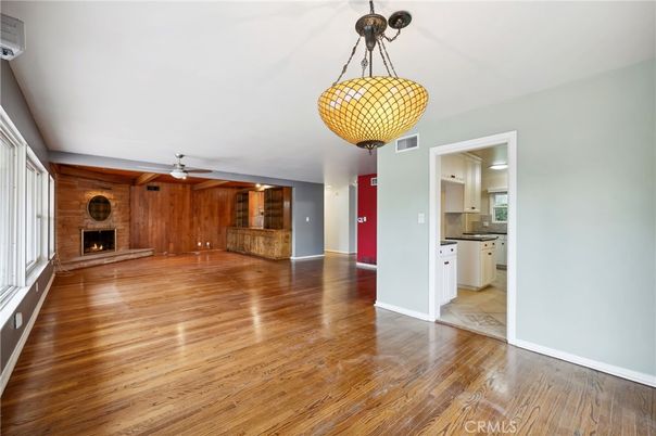 Empty room, Fireplace, Interior, Kitchen, Pendant Lights, Wood Texture Flooring