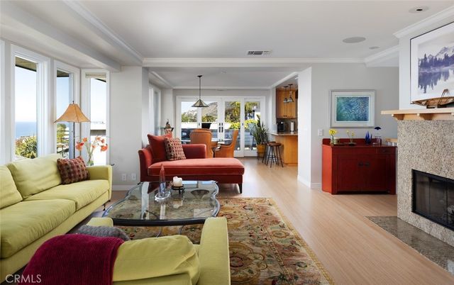 Dining room, Fireplace, Interior, Living room, Pendant Lights, Water, Wood Texture Flooring