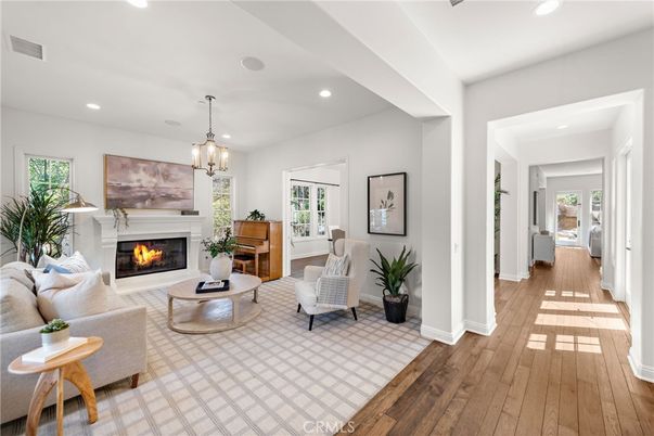 Chandelier, Fireplace, Interior, Living room, Pendant Lights, Recessed Lighting, Wood Texture Flooring