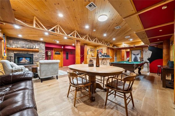 Billiard Table, Fireplace, Game Room, Interior, Living room, Recessed Lighting, Stone Walls, Wooden Ceilings, Wood Texture Flooring