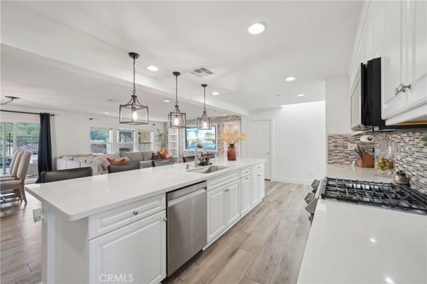 Dining room, Interior, Kitchen, Living room, Pendant Lights, Recessed Lighting, Stainless Steel Appliances, Wood Texture Flooring