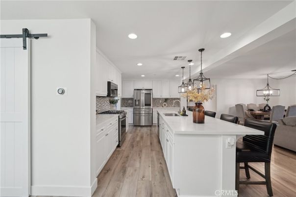 Dining room, Interior, Kitchen, Living room, Pendant Lights, Recessed Lighting, Stainless Steel Appliances, Wood Texture Flooring