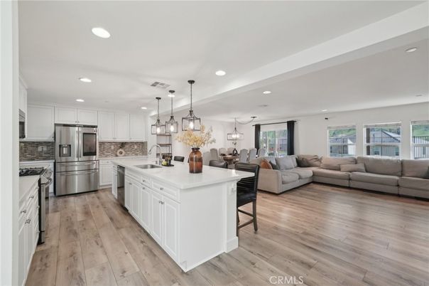 Dining room, Interior, Kitchen, Living room, Pendant Lights, Recessed Lighting, Stainless Steel Appliances, Wood Texture Flooring