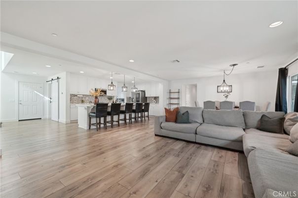 Dining room, Interior, Kitchen, Living room, Pendant Lights, Recessed Lighting, Stainless Steel Appliances, Wood Texture Flooring