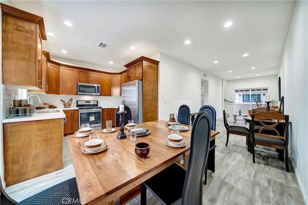 Dining room, Interior, Kitchen, Recessed Lighting, Stainless Steel Appliances, Wood Texture Flooring