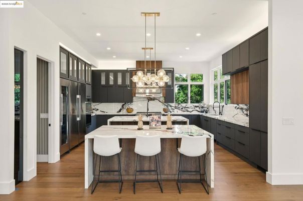 Interior, Kitchen, Marble Walls, Pendant Lights, Recessed Lighting, Stainless Steel Appliances, Wood Texture Flooring