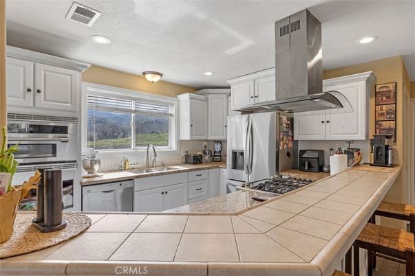 Interior, Kitchen, Recessed Lighting, Stainless Steel Appliances, Tile Countertops