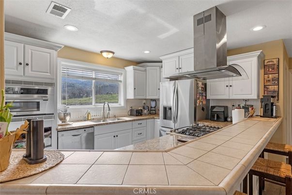 Interior, Kitchen, Recessed Lighting, Stainless Steel Appliances, Tile Countertops
