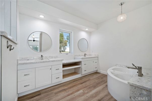 Bathroom, Dual Sink Vanities, Free Standing Baths, Interior, Pendant Lights, Recessed Lighting, Wood Texture Flooring
