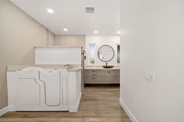 Bathroom, Dual Sink Vanities, Interior, Recessed Lighting, Wood Texture Flooring