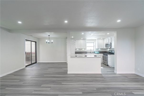 Chandelier, Interior, Kitchen, Pendant Lights, Recessed Lighting, Stainless Steel Appliances, Wood Texture Flooring