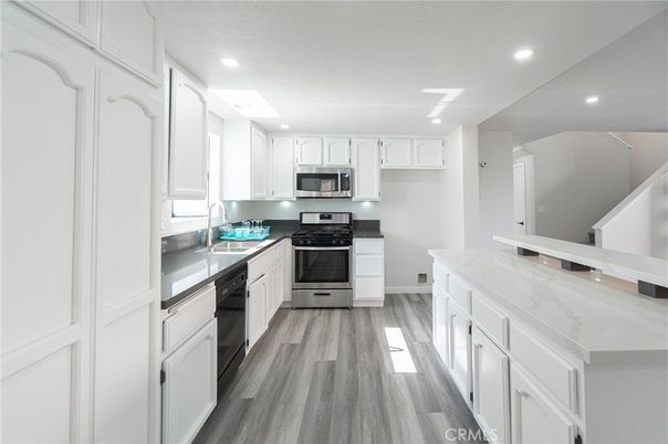 Interior, Kitchen, Recessed Lighting, Stainless Steel Appliances, Wood Texture Flooring