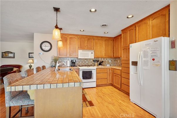 Interior, Kitchen, Pendant Lights, Recessed Lighting, Tile Countertops, Wood Texture Flooring