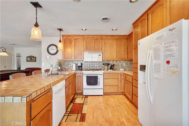 Interior, Kitchen, Pendant Lights, Recessed Lighting, Tile Countertops, Wood Texture Flooring